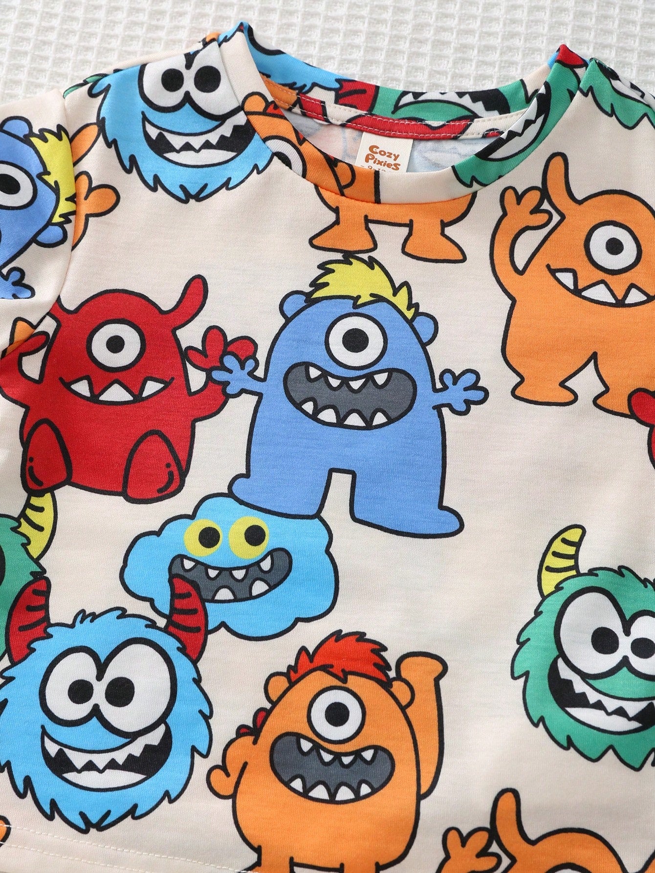 Conjunto 2 Peças Bebê Menino Camiseta Monstros Colorida e Shorts Liso