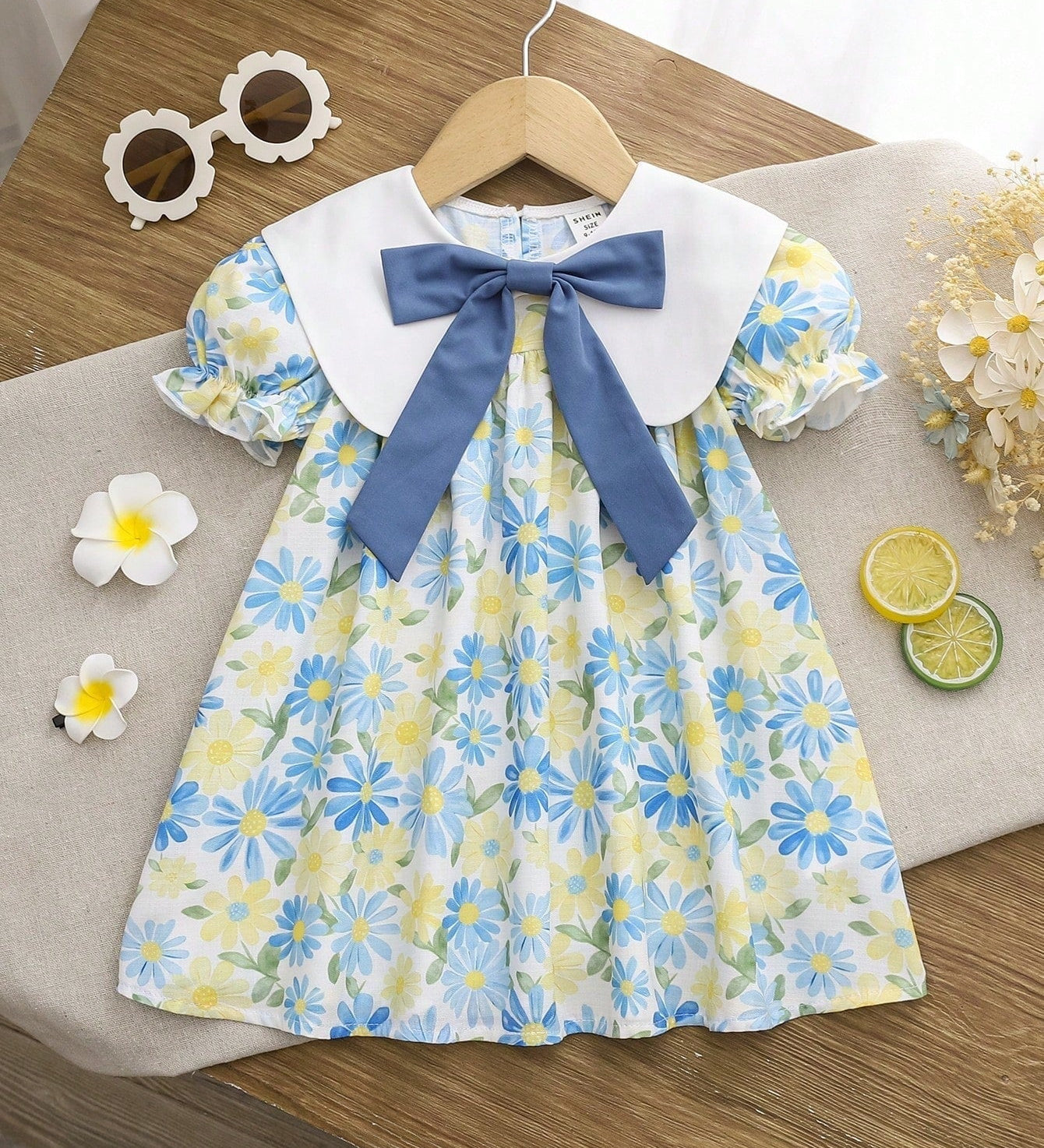 Vestido Bebê Menina Manga Curta Bufante Gola Marinheiro Laço Estampa Floral 003 Vestido Menina 11 Kabannas Colorido 6-9 Meses 